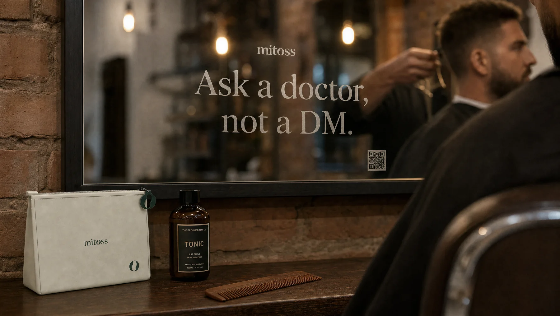 A barbershop mirror lettered Ask a doctor, not a DM, with the Mitoss pouch on the shelf