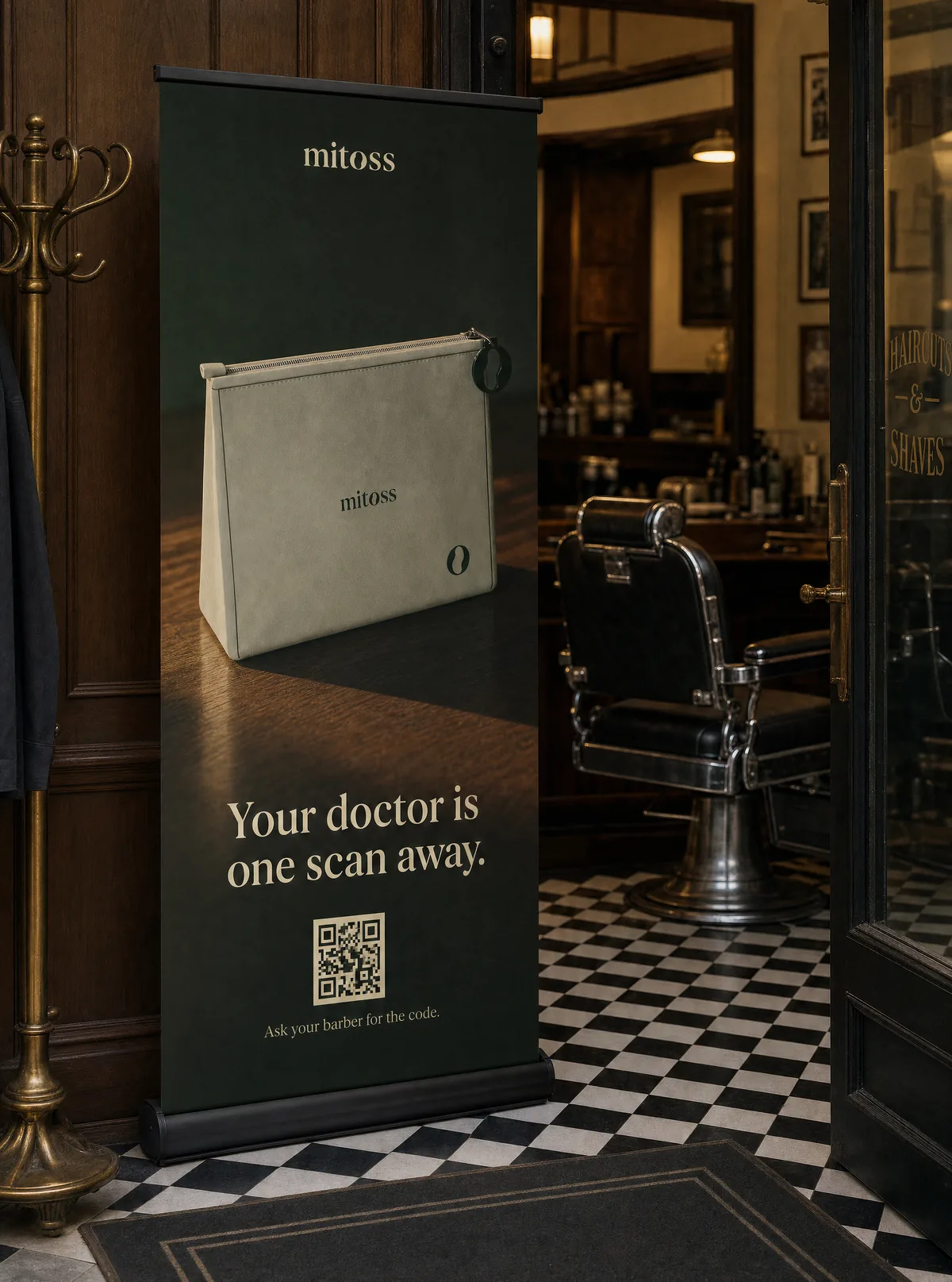 A dark roll-up banner in a barbershop: Your doctor is one scan away